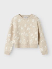 Beżowy sweter z wełny o krótkim kroju. Zawiera teksturowane białe litery tworzące słowa "Paris" i "French" w różnych rozmiarach, z długimi rękawami.