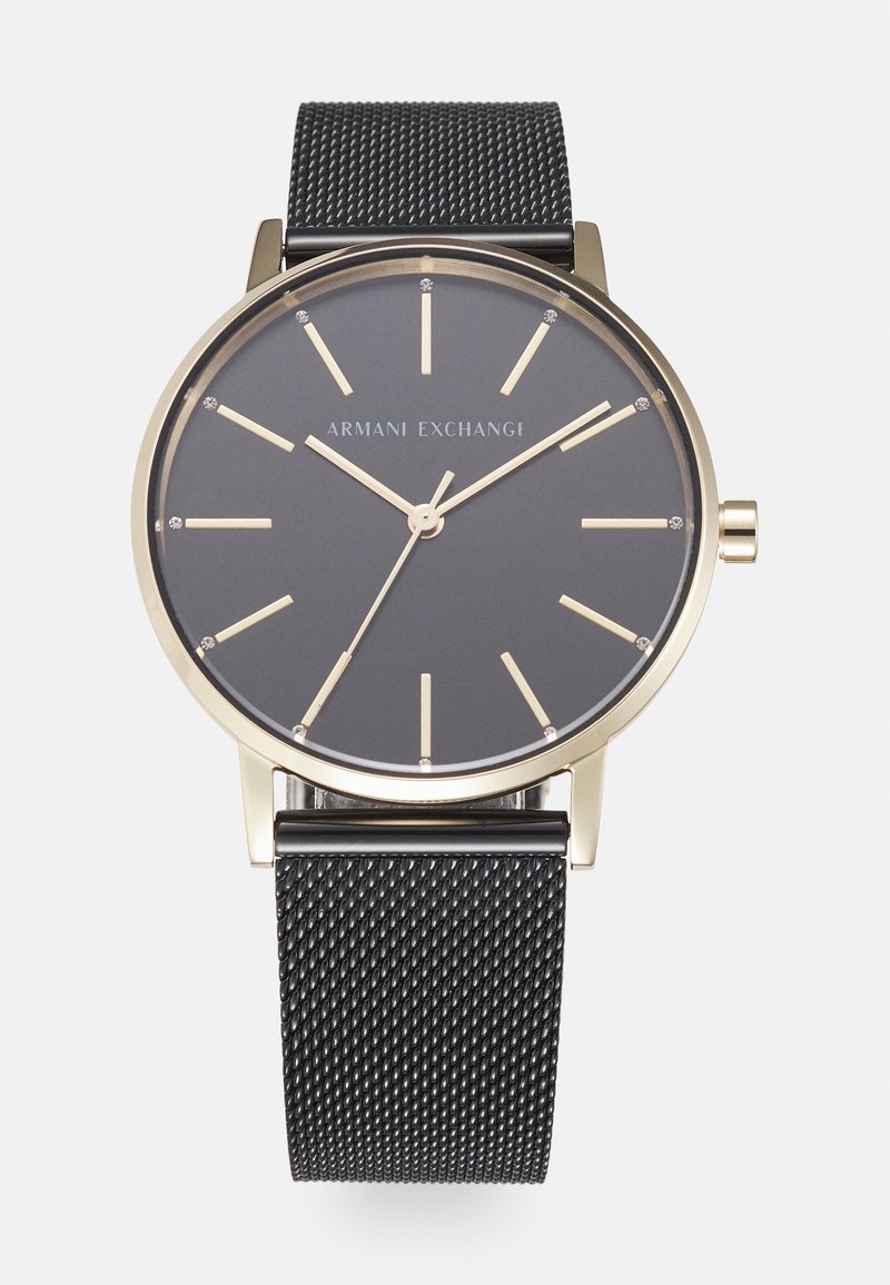 Black Milanese mesh strap watch with a gold-tone case, grey dial, gold hour markers, and hands. Features a minimalist design with crystal accents.