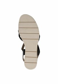 Black sandal with a textured sole, featuring a rubber outer and adjustable straps. Size 37 marked on the inner sole.