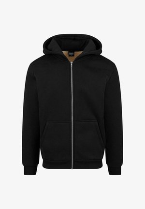 Fekete cipzáras kapucnis pulóver, amely puha anyagból készült. Kihúzható kapucnival, elülső zsebekkel és bordázott mandzsettákkal és aljjal rendelkezik. Egyszerű, hétköznapi dizájn.