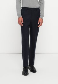 Navy tailored trousers made of wool blend fabric, featuring a straight cut, front pockets, belt loops, and a single button closure.