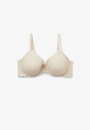 Beige kanten bh met golvende randen, met vullende cups en verstelbare bandjes. Bloemmotief op de stof, gladde textuur en haaksluiting aan de achterkant.