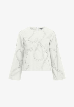 Valkoinen puuvillapusero pitkillä hihoilla, jossa on teksturoidut röyhelöyksityiskohdat virtaavassa, abstraktissa kuviossa. Selän vetoketjusuljenta.