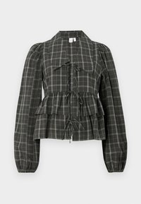 Green checkered blouse with peplum hem, tie details, long puffed sleeves, and collared neckline, made of lightweight fabric.