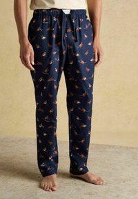 Jūras spēku pidžamu bikses ar putnu rakstu, ar elastīgu jostu un strings. Izgatavotas no mīkstas auduma, ar taisnu kāju griezumu.