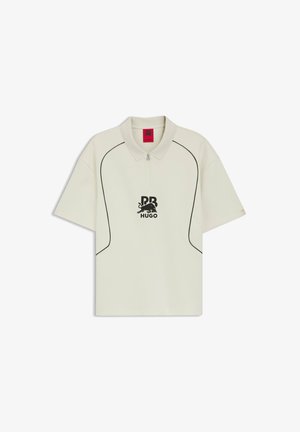 Off-white short-sleeve polo shirt with black piping, half-zip collar, and black "RB HUGO" logo with a bull graphic on the chest.