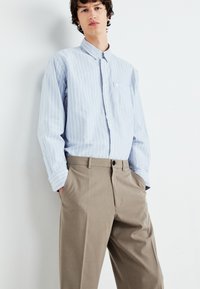 Weekday FLARED SUIT TROUSERS - Pantalon classique - dark mole