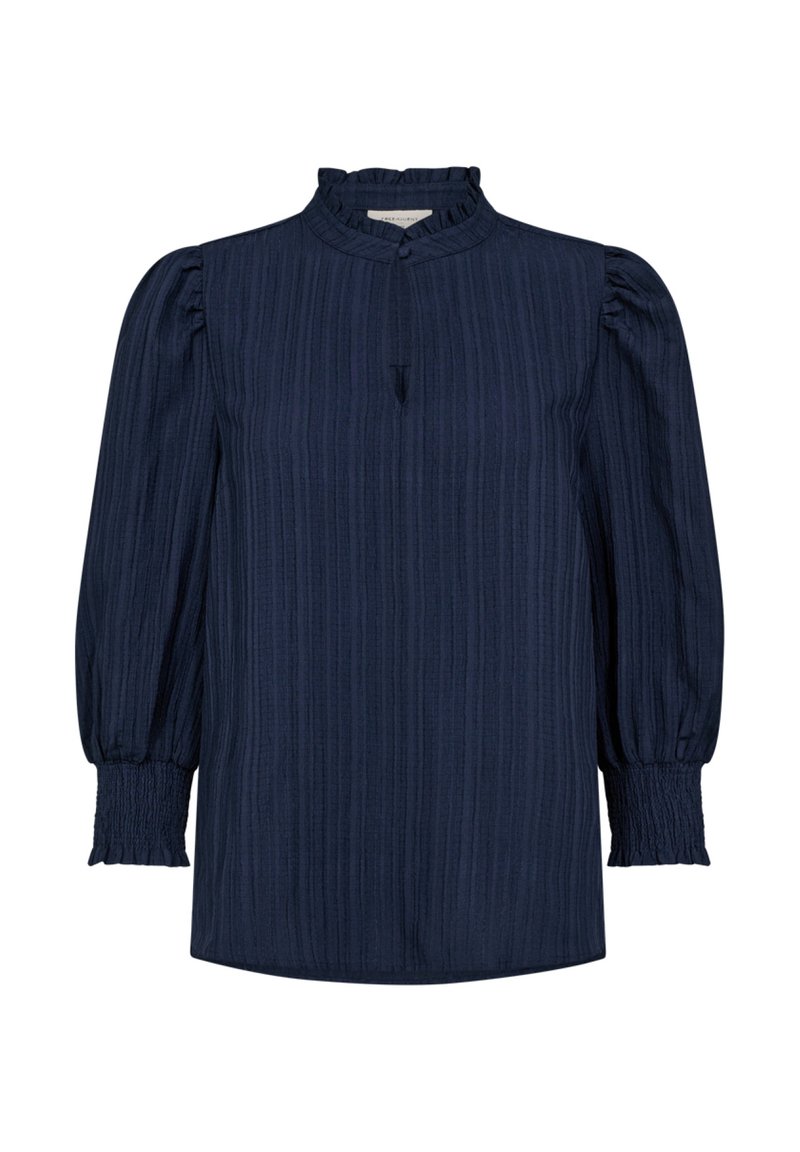 Marineblauwe blouse met lange mouwen, voorzien van een textuur, geribbelde ontwerp, hoge kraag en geplooide pofmouwen. Voorzien van knopen aan de voorkant en een split.