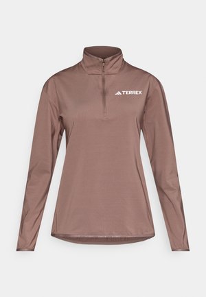 Bruine pullover met lange mouwen en een halve rits aan de kraag, gemaakt van lichtgewicht stof. Met "TERREX" logo op de linkerborst.