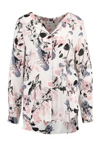 Blouse à manches longues en tissu blanc avec un imprimé floral multicolore en rose, noir et bleu. Fermeture à boutons sur le devant avec une coupe décontractée.
