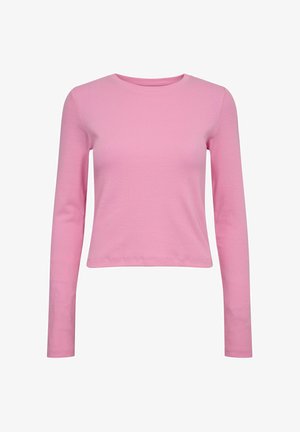 Pikad varrukad, poolelioleva sobivusega topp, mis on valmistatud roosast ribakangast; omaduseks on ümmargune kaelus ja lühendatud serv. Ühtlane tekstuur kogu ulatuses.