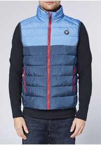 Padded vest featuring a light blue upper section, dark blue lower section, red zipper, and a circular logo on the left chest.