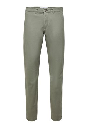 Kerged rohelised puuvillased püksid, sirge lõikega, nupuga kinnitamise ja vöödega, sujuva matista tekstuuriga.