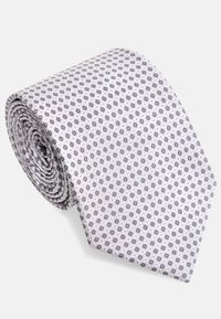 Cravate grise et blanche avec un petit motif circulaire, de forme roulée, texture lisse et pointe effilée, en matériau tissu.