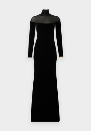 Črna žametna obleka z dolgimi rokavi, visokim ovratnikom in prosojnim mrežnim detajlom na ramenih. Ima zlate akcentne detajle na manšetah in je dolga do tal.