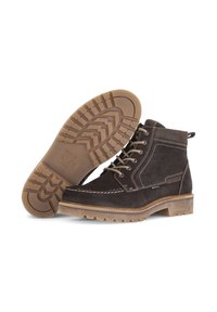 Stivali ankle in pelle marrone con suola robusta, dettagliamo cuciti e design con lacci. Presentano un anello sul tallone per una facile vestibilità.