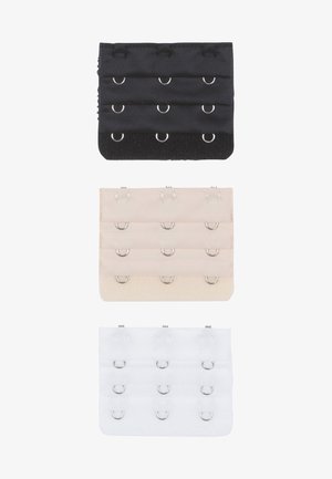 Tričko s háčikmi a okami v čiernej, béžovej a bielej farbe. Každý má šesť radov s obvodovými kovovými krúžkami a elastickými popruhmi na upevnenie.