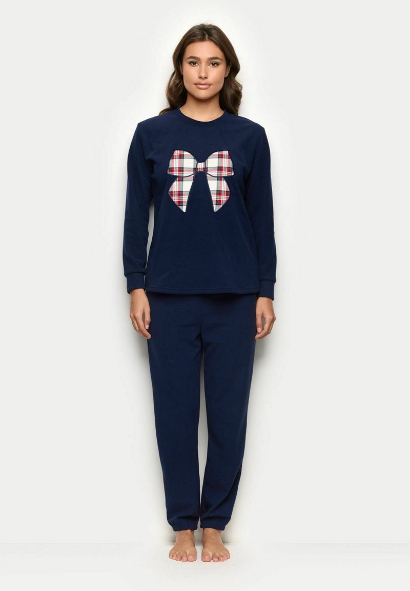 Mørkeblå pyjamas sæt med en langærmet top med et stort plaidet bue-grafik og matchende bukser med en afslappet pasform og samlede manchetter.