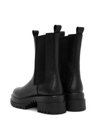 Black leather ankle boots with elastic side panels, flat rubber soles, and pull tabs. Features a chunky heel with a treaded pattern.