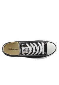 Zapatillas de lona negras con puntera y suela de goma blanca. Presenta cordones blancos, detalles de costura y una etiqueta de marca en el interior. Talla 37.