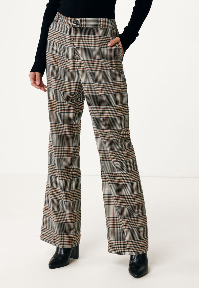 Checkered trousers in black, white, and orange tones. High-waisted with flared legs, pockets, and a button closure. Smooth fabric texture.
