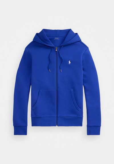 Casaco com fecho éclair azul, com bolsos frontais, capuz com cordão e pequeno logótipo branco da Polo Ralph Lauren no peito.