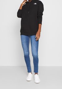 The North Face Felpa con cappuccio - black