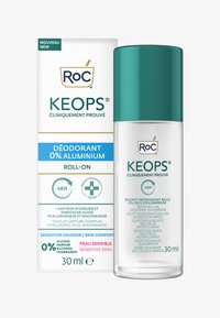 Déodorant roll-on dans un flacon en verre transparent avec un capuchon turquoise. Accompagné d'une boîte blanche portant un texte vert et bleu. 30 ml.