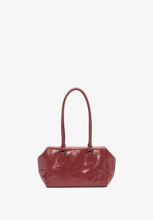 Red glossy handbag with two long handles, rectangular shape, smooth texture, and subtle creased pattern. Features silver-tone hardware.