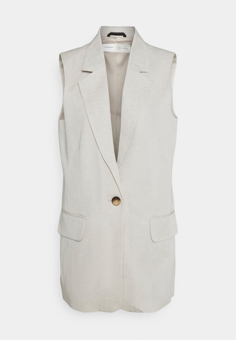Ärmlös beige blazerväst med breda slag, en enda brun knapp stängning och två framfickor med lock.