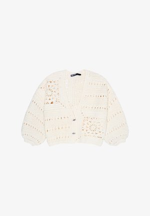 Cream-colored crochet cardigan with balloon sleeves, V-neck, two buttons, and floral square patterns on front panels.