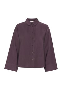 Camicia oversize viola con colletto classico e maniche lunghe. Presenta una texture liscia e cinque bottoni coordinati lungo il davanti.
