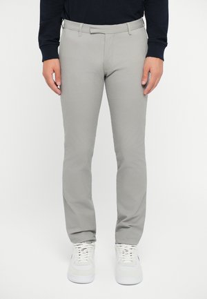 Light grey tailored trousers with a sleek, smooth texture. Features a standard waistband and side pockets, paired with white sneakers.