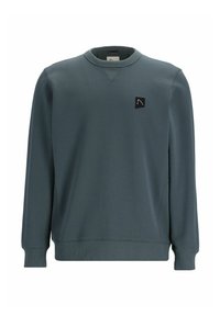 Sudadera de un azul oscuro con mangas largas, cuello redondo, puños y dobladillo acanalados, que presenta un pequeño logo negro en un parche en el pecho.