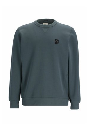 Dark teal sweatshirt with long sleeves, round neckline, ribbed cuffs and hem, featuring a small black patch logo on the chest.