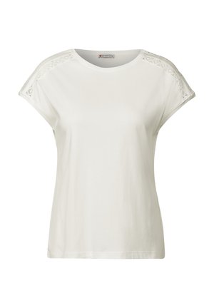 Biała koszulka z krótkim rękawem, wykonana z bawełny, z koronkowymi detalami na ramionach, okrągłym dekoltem i luźnym krojem.