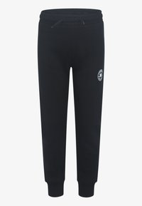 Svarta mjukisbyxor i ett mjukt material, med dragsko i midjan, ribbade muddar och ett runt logopatch på vänster lår.
