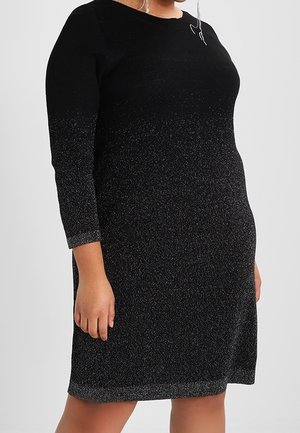 Black dress with three-quarter sleeves, featuring a gradual metallic shimmer from black to silver. Soft, textured fabric with a rounded neckline.