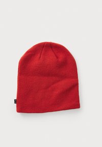 Red knit beanie with a soft texture, featuring a rolled brim and a small black label on the side. Simple, cylindrical design.