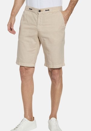 Beige linen shorts with an elastic waistband, front pockets, and drawstring detailing; hemmed cuffs and relaxed fit.