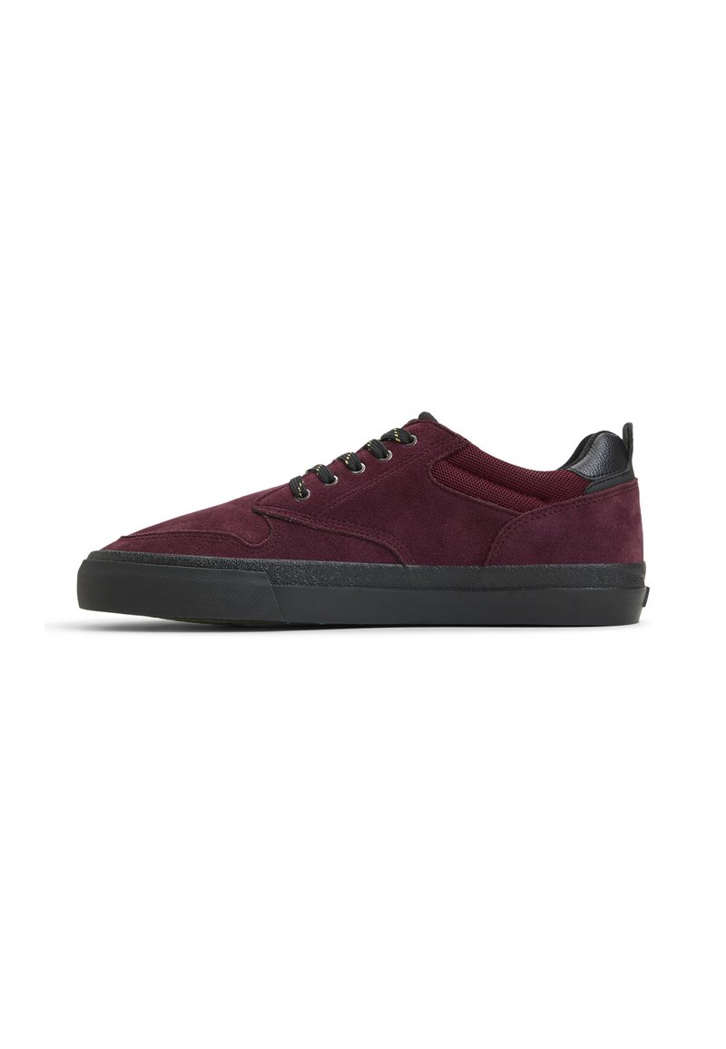 Burgundy suede sneakers with black rubber sole, featuring round laces and mesh accents on the side for ventilation.