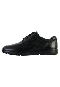 Sneaker in pelle nera con profilo basso, punta arrotondata, chiusura con lacci e dettagli testurizzati sui lati e sul tallone.