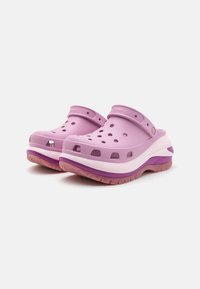 Pink synthetic clogs with ventilation holes, a wide strap, and a cushioned sole featuring a gradient purple accent on the base.