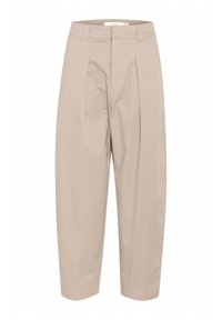 Béžové bavlněné kalhoty s vysokým pasem, s detailem skládání, bočními kapsami a zúženým střihem pro pohodlné nošení.