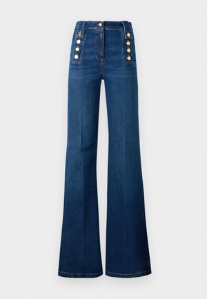 High-waisted flared jeans in dark blue denim, featuring gold button accents on the sides and a smooth texture.