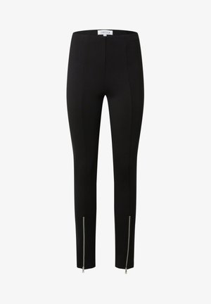 Black fitted leggings with a smooth texture, featuring zippered accents at the ankles and a high-rise waistband for a sleek silhouette.