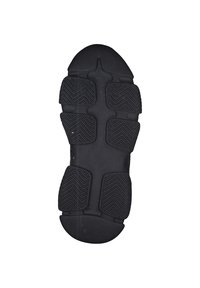 Sole di scarpa sportiva nera con gomma testurizzata e modelli di battistrada pronunciati per aderenza, forma curva sul tallone e area della punta liscia.