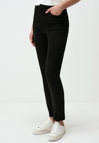 HIGH-RISE  - Slim fit jeans - black