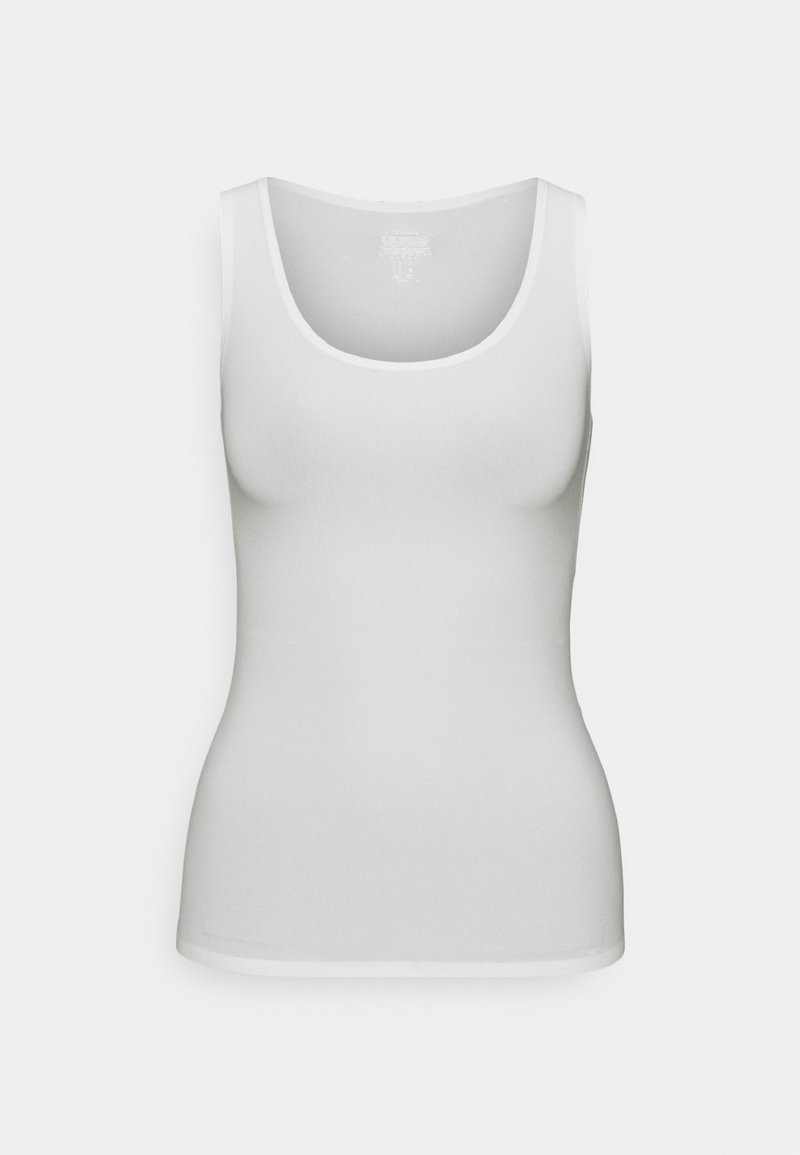 Un débardeur blanc sans manches avec un col arrondi, fabriqué en tissu extensible doux, coupe ajustée, bords nets et sans motifs ni designs visibles.