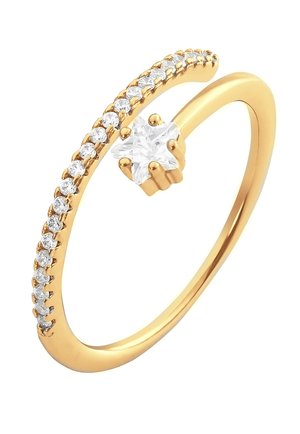 Bague en or avec un design courbé, ornée de petites pierres claires sur un côté et d'une pierre claire en forme d'étoile au sommet.